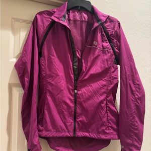 Pearl Izumi Elite Barrier cycling jacket in a magenta/pink color size medium.